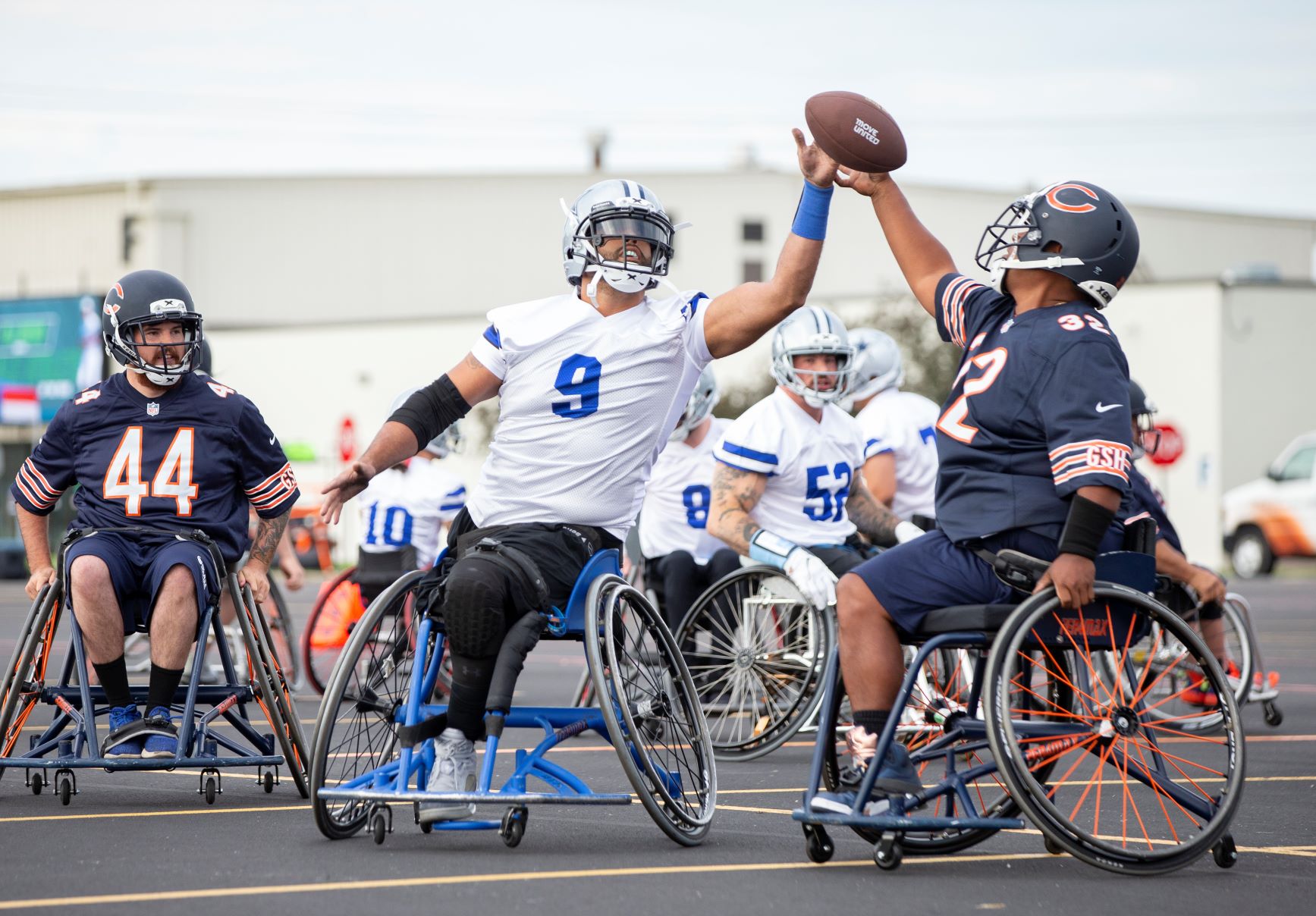 A Dallas Cowboys Wheelchair Football Player goes against a Chicago Bears Wheelchair Football Player during a USA Wheelchair Football League Tournament. Photo by Scott Paulus.