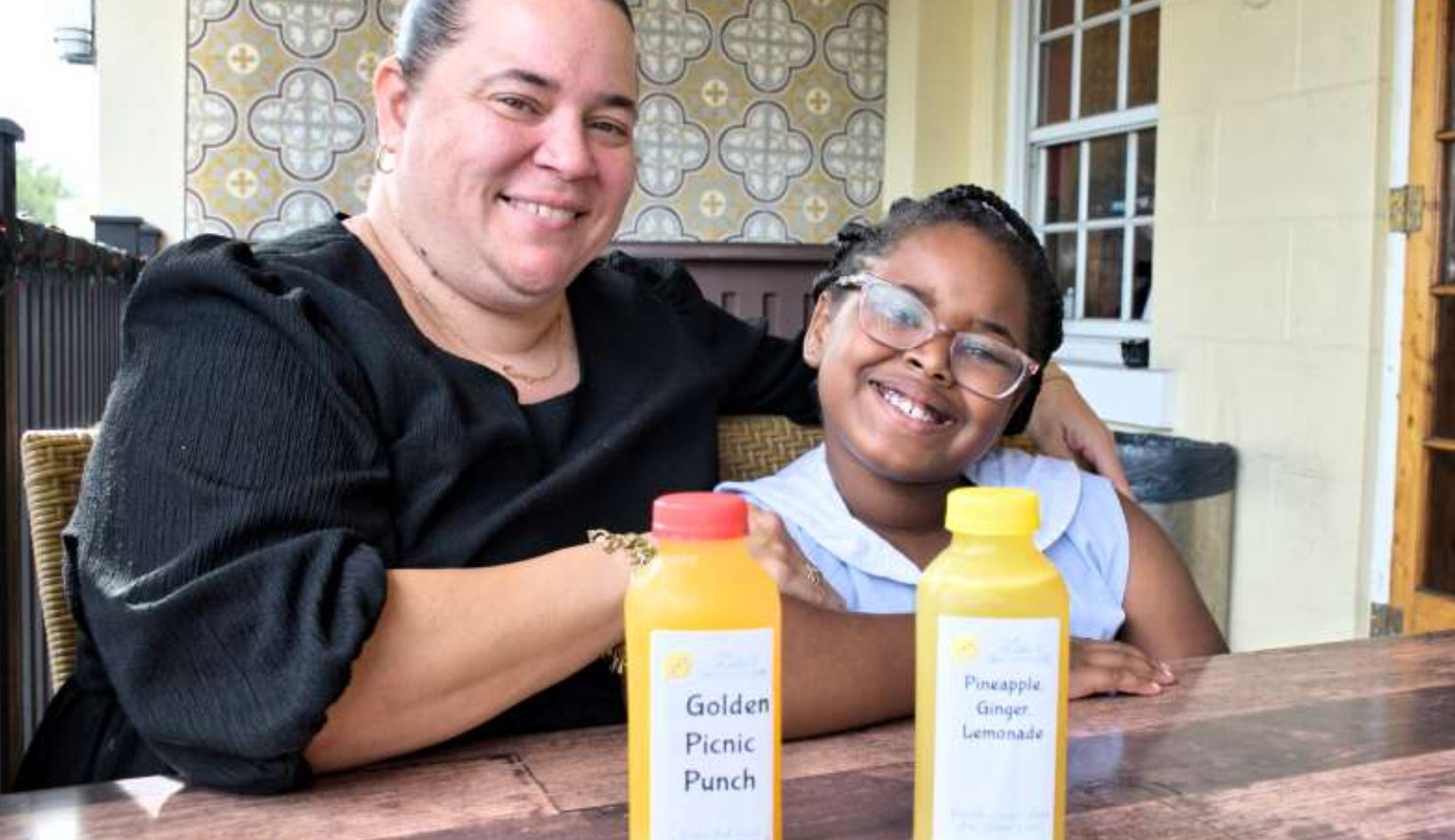 Lindsay Simmons and daughter Laundyn, 8, with some of their Lulu’s Sweet and Refreshing Juices (Photograph by Jessie Moniz Hardy)