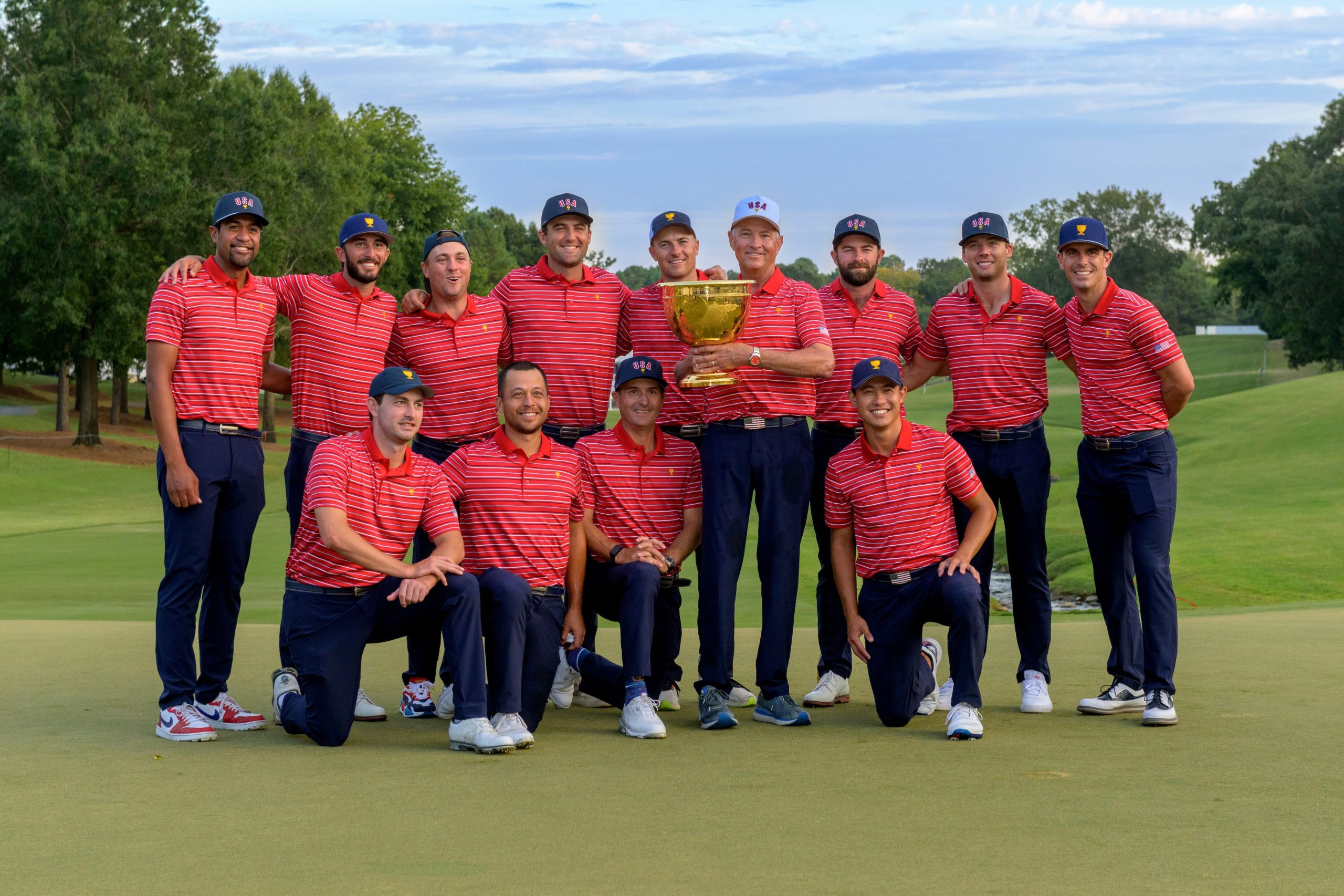 The United States Team pose for a photograph with the Presidents Cup Trophy after defeating the International Team by 17.5 points to 12.5 at the Quail Hollow Club